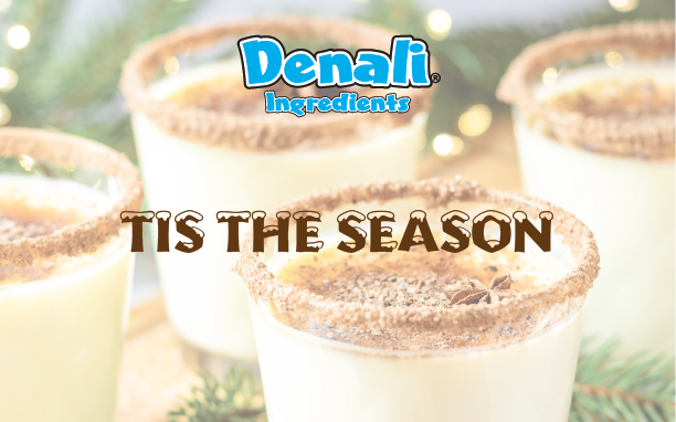 Four glasses of eggnog in the background, with the Denali Ingredients logo centered at the top of the page and the phrase 
